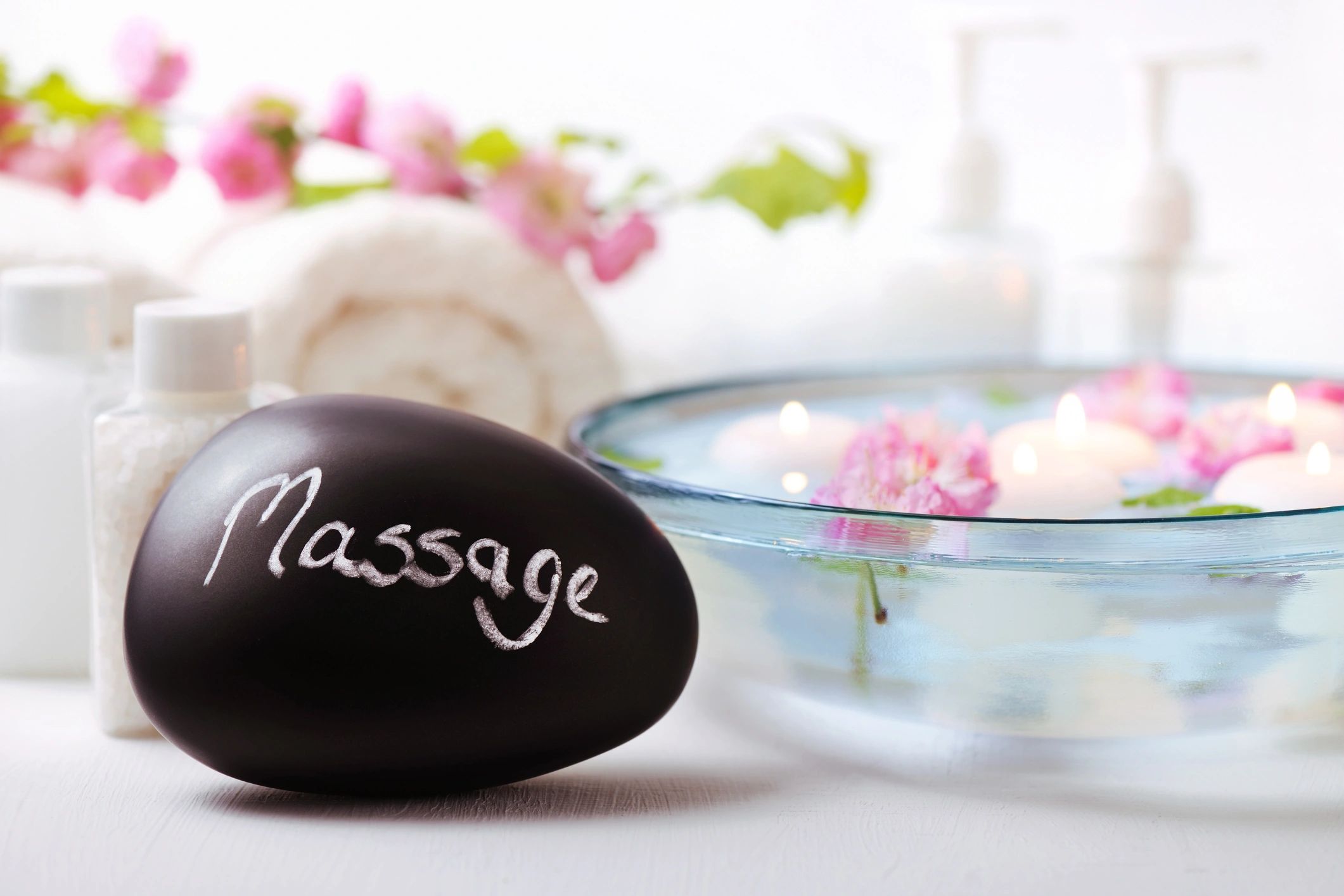 Spa treatment setup with candle and relaxation items