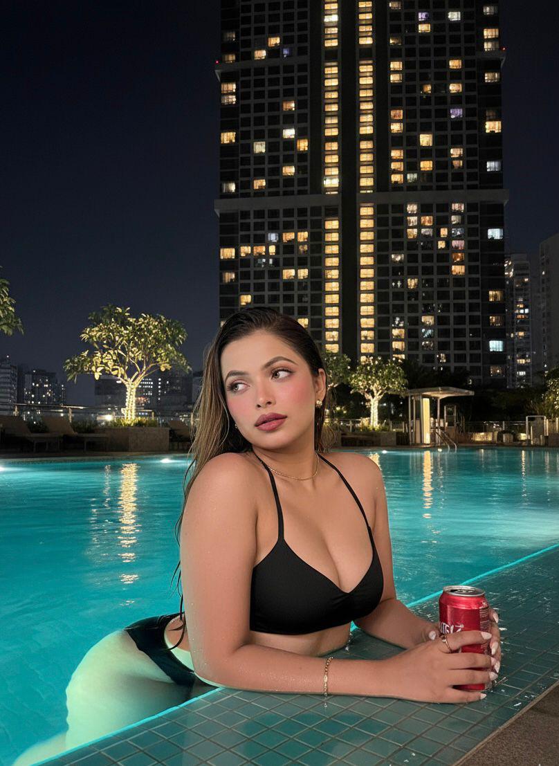 Guest portrait at illuminated pool at night